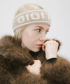 Gigi Pip winter hats for women - Ashton Retro Headband - 10% wool + 90% acrylic classic retro ski style headbands with limited edition holiday logo [taupe]