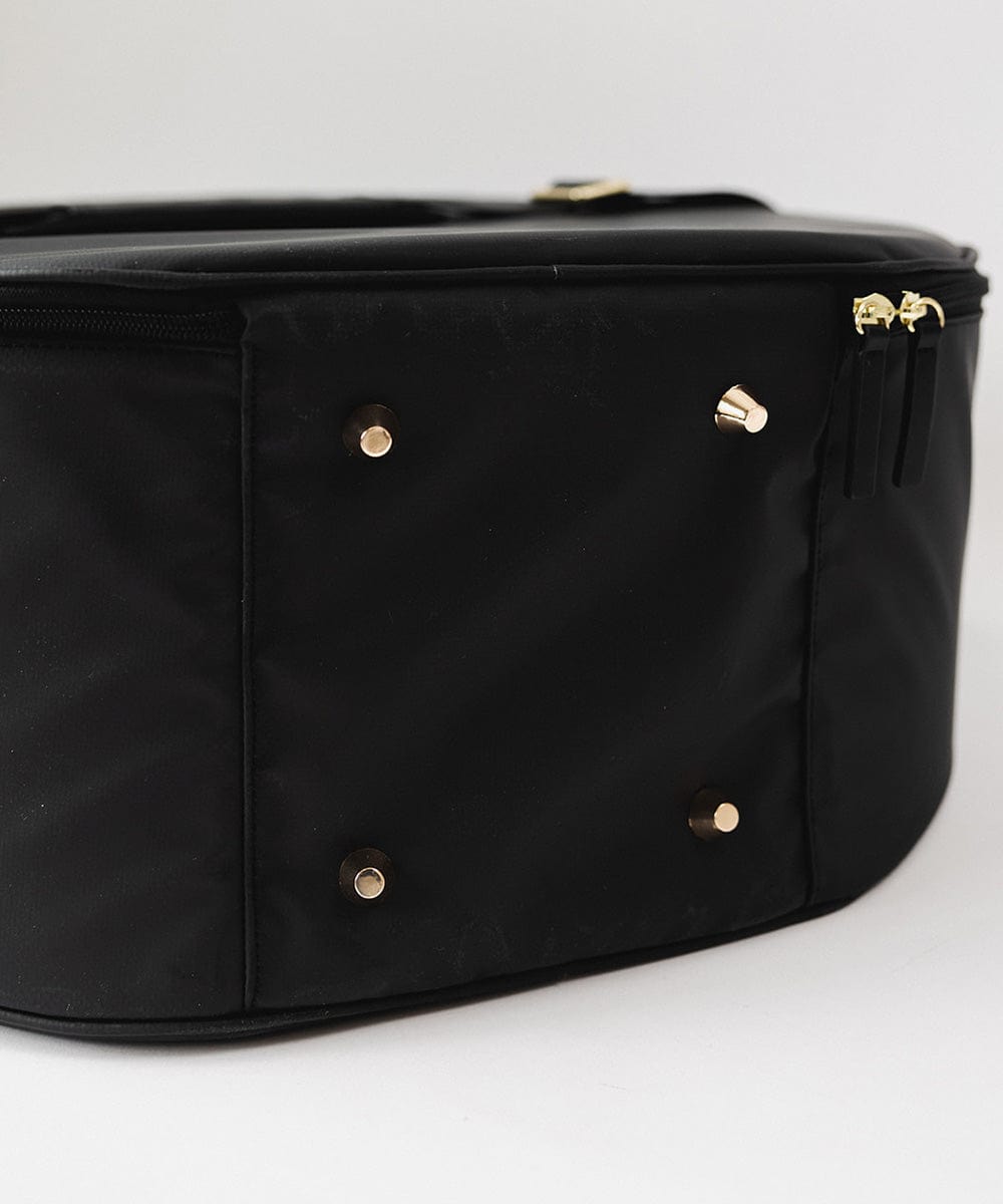The bottom side of a black hat travel case against a plain background #color_black