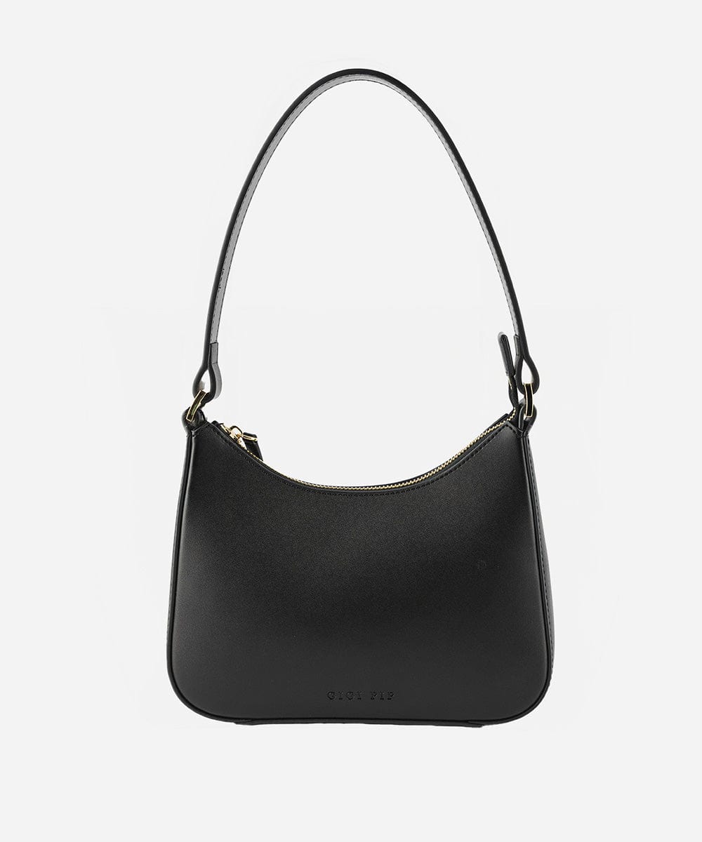 A black genuine leather handbag with a shoulder strap against a plain background #color_black