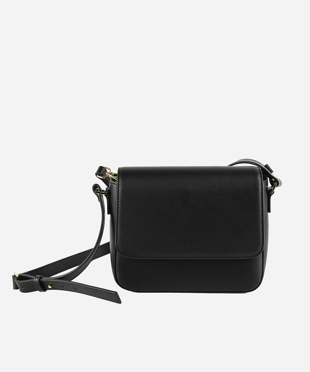 A black Rhys Crossbody Genuine Leather Bag with a detachable strap, displayed against a plain background. #color_black