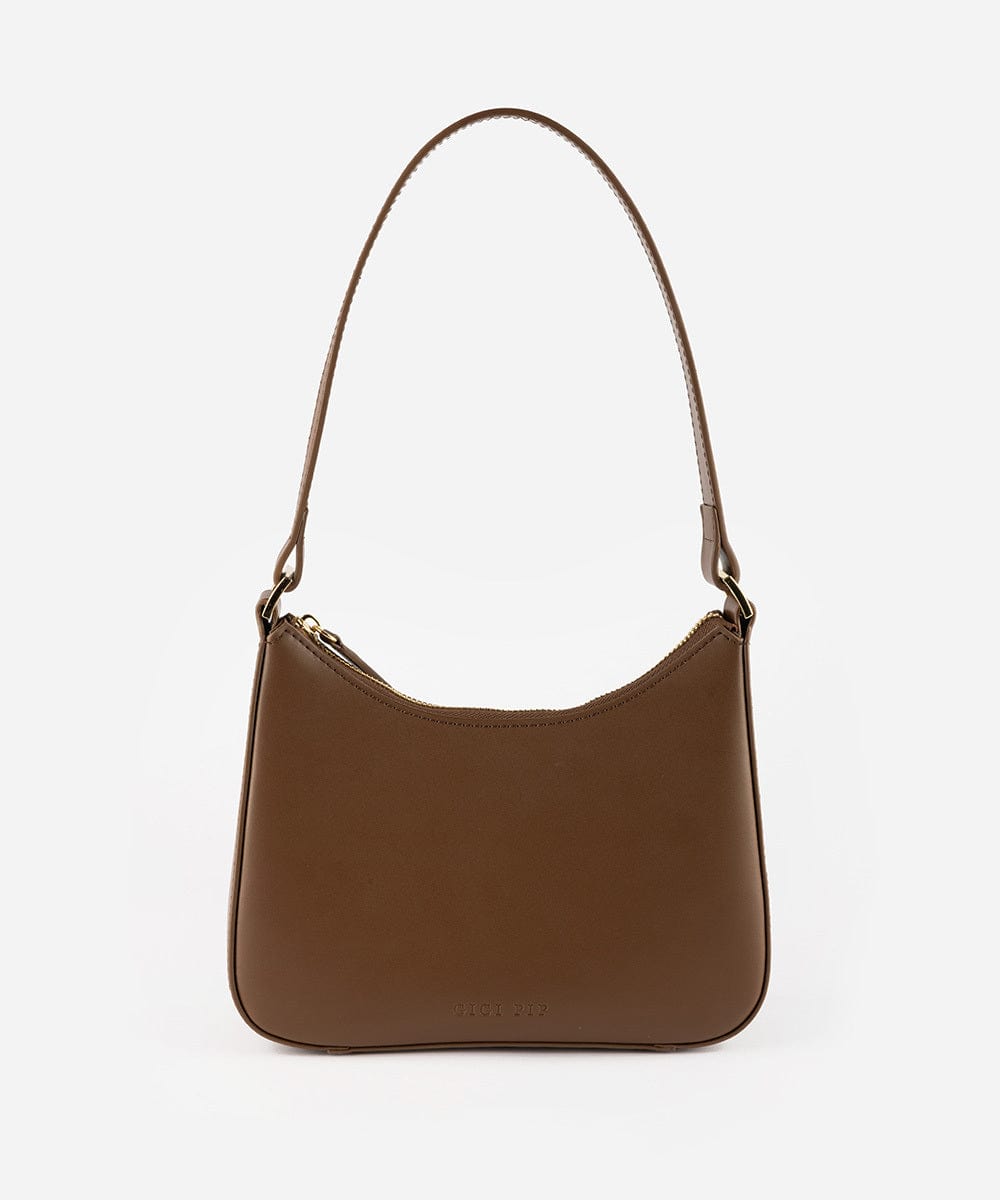 A chocolate colored genuine leather handbag with a shoulder strap against a plain background #color_chocolate
