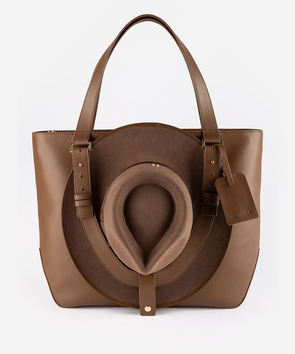 A brown Hayes Hat Carrying Tote made of genuine leather, displayed against a white background. #color_chocolate