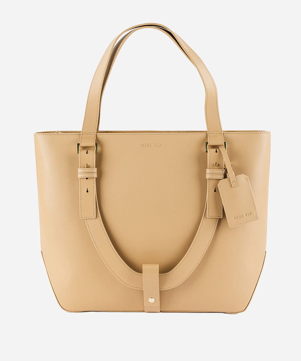 A beige Hayes Hat Carrying Tote made of genuine leather, displayed against a white background. #color_tan