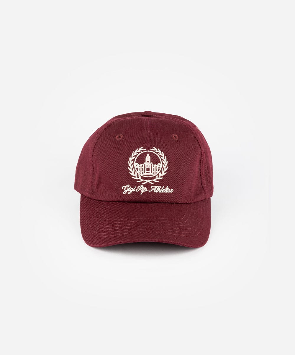A burgundy ball cap with a white logo and text on a plain background #color_burgundy