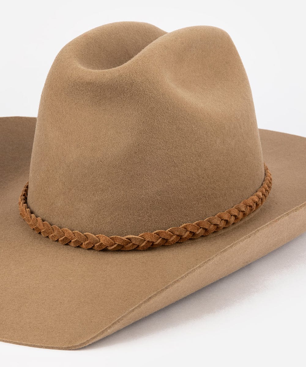 Brown cowboy hat with braided leather band on a white background #color_caramel