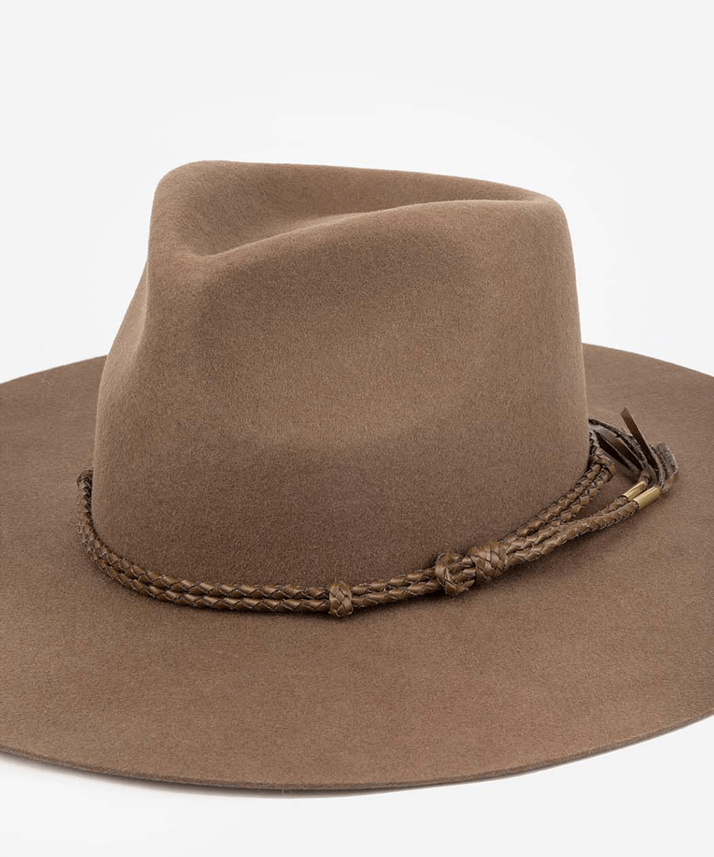 Brown cowboy hat with braided band on a white background #color_brown