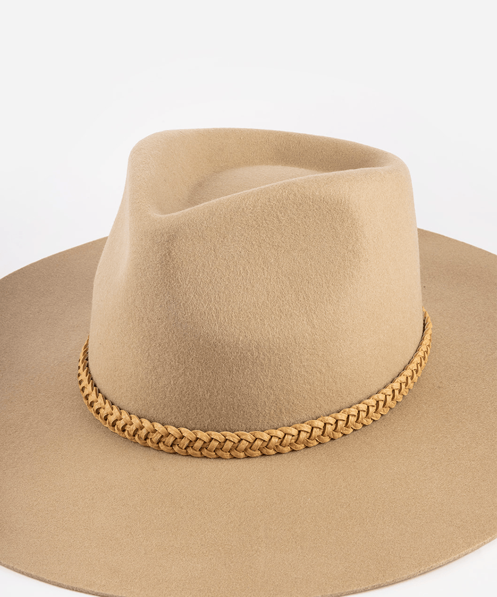 Beige cowboy hat with braided band on a white background #color_tan