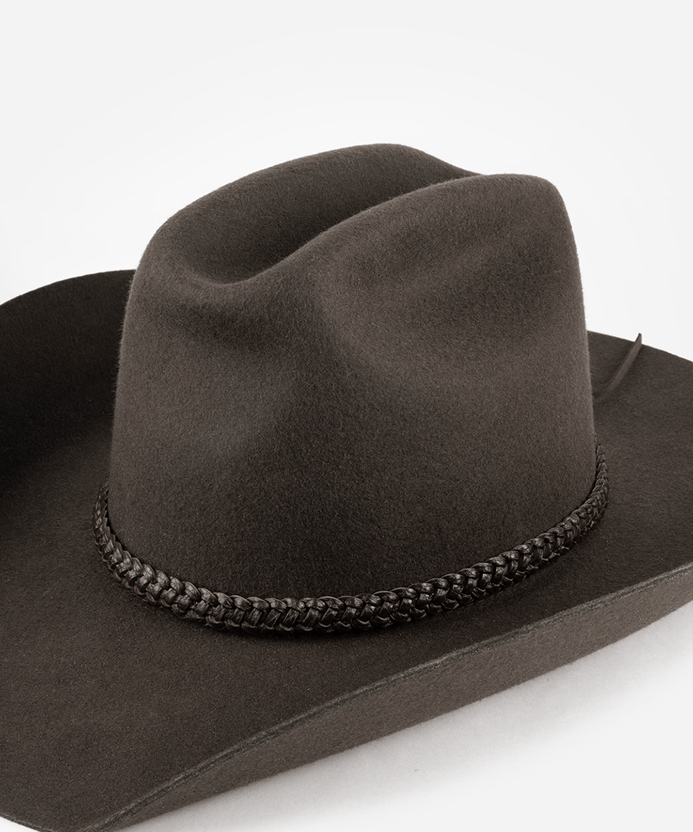 Brown cowboy hat with braided band on a white background #color_dark brown