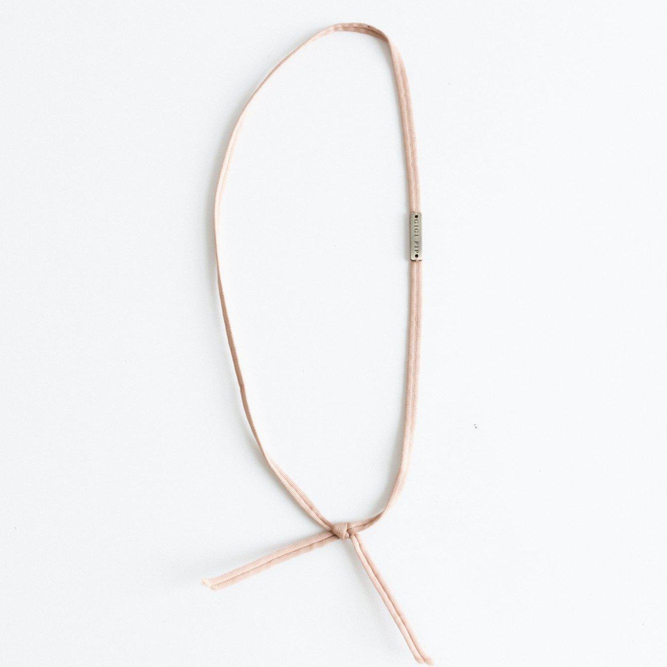 A dusty pink colored grosgrain band on a plain background #color_dusty pink