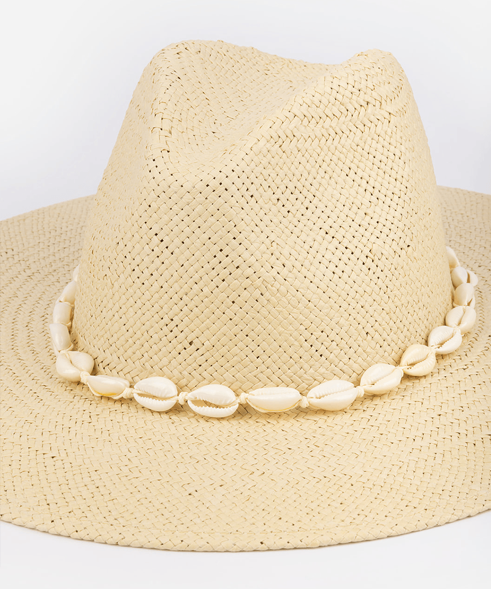 Beige straw hat with shell embellishments on a white background #color_natural