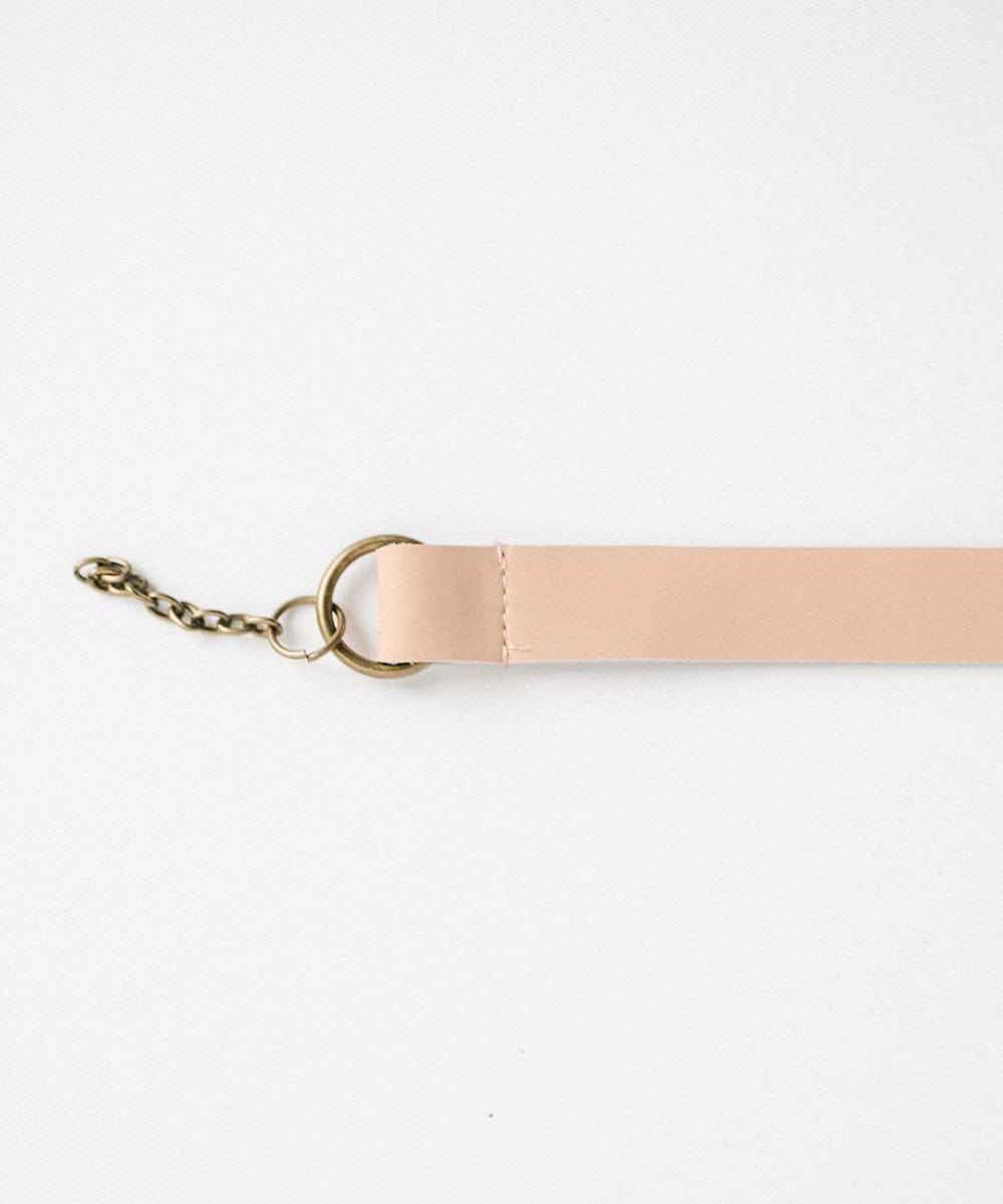 A nude colored leather adjustable chain band on a white background #color_nude