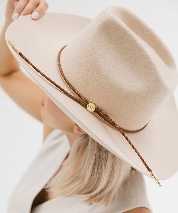 Gigi Pip hat bands + trims for women's hats - Thin Braided Wrap Band - thin braided leather adjustable hat band featuring a plated gold Gigi Pip circle logo and detailing [cognac]