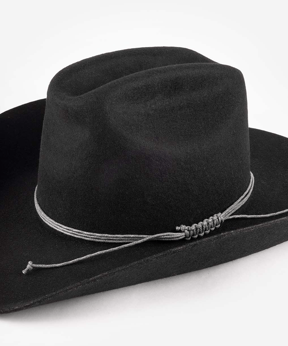 Black cowboy hat with a string triple wrap band on a white background #color_stone