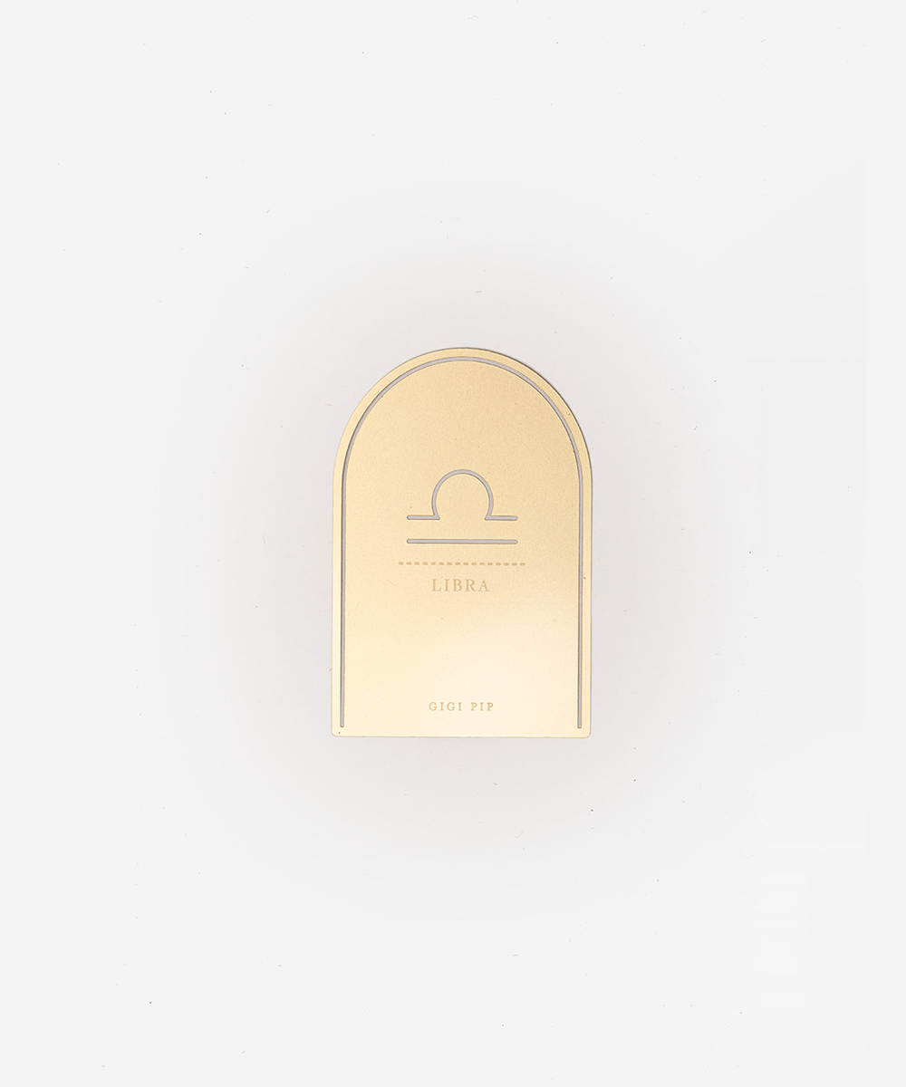 Gold 'Libra' zodiac sign plaque on a light gray background #color_gold