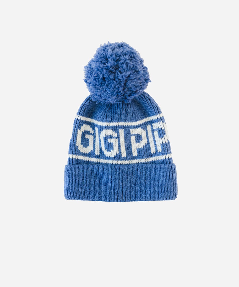 An arctic blue colored knit beanie with pom-pom and 'GIGI PIP' branding on a white background #color_arctic blue