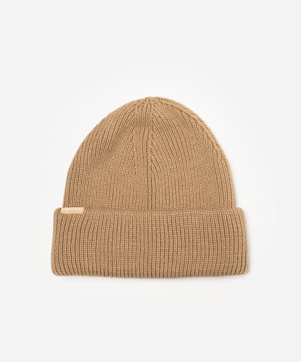 Beige knit beanie on a light gray background #color_tan