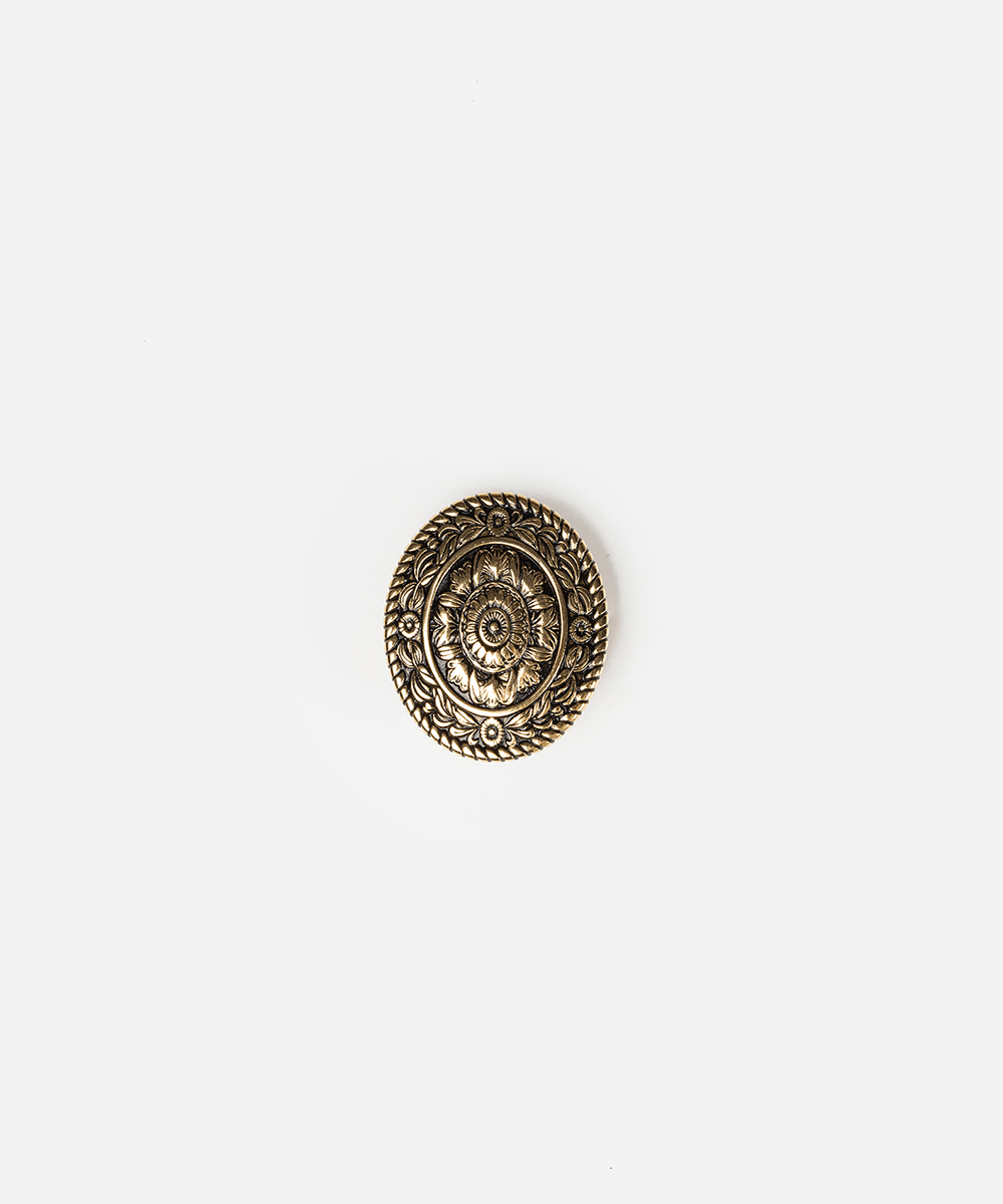 An oval-shaped antique bronze decorative button or cabochon with an embossed floral and rope border design, centered on a plain white background #color_gold