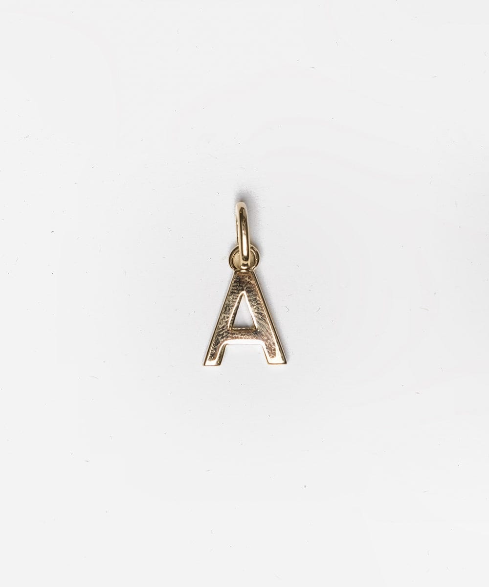 A gold letter 'A' hat charm on a white background #color_gold