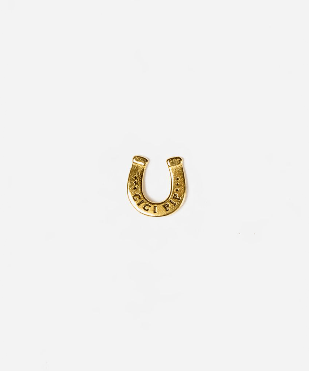Gold horseshoe-shaped hat pin on a white background #color_gold