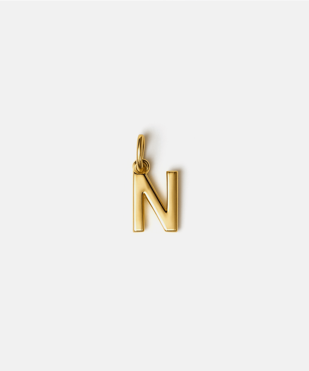 Gold letter 'N' pendant hat charm on a white background #color_gold