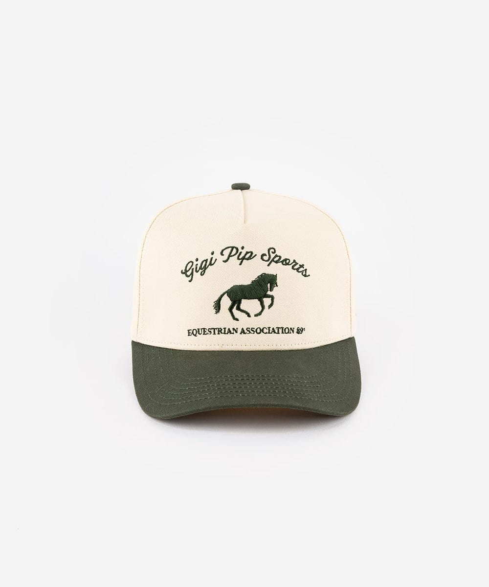 A cream and dark green Trucker hat with 'Gigi Pip Sports' and horse logo on a white background #color_cream - dark green