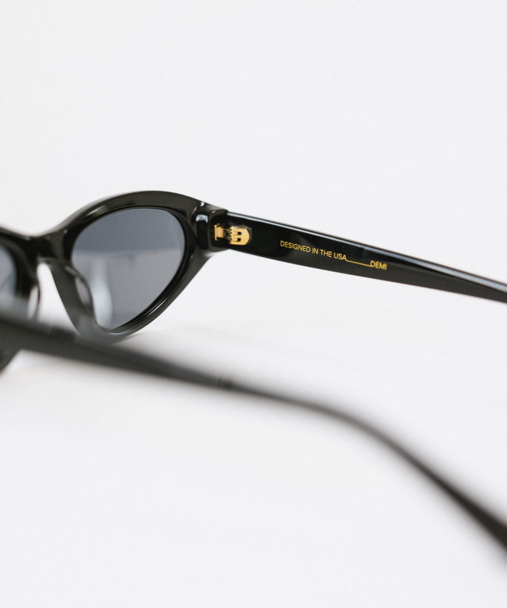 Black colored cat eye sunglasses on a white background #color_black