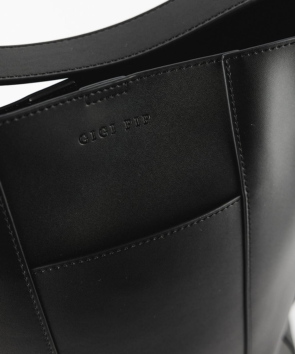 Close up image of a black Dia Everyday Leather Tote Bag against a plain background #color_black