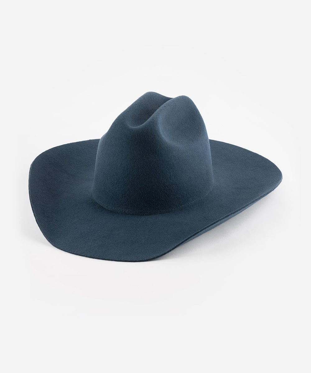 A vintage blue colored cowboy hat with a wide brim and a true western cattleman crown. #color_vintage blue