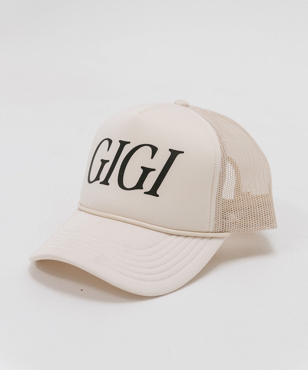 A cream cap with 'GIGI' text on a white background #color_cream