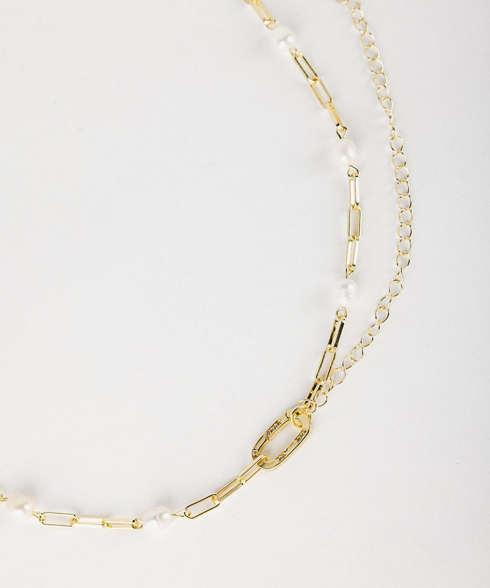 A gold pearl paperclip chain band on a white background #color_gold