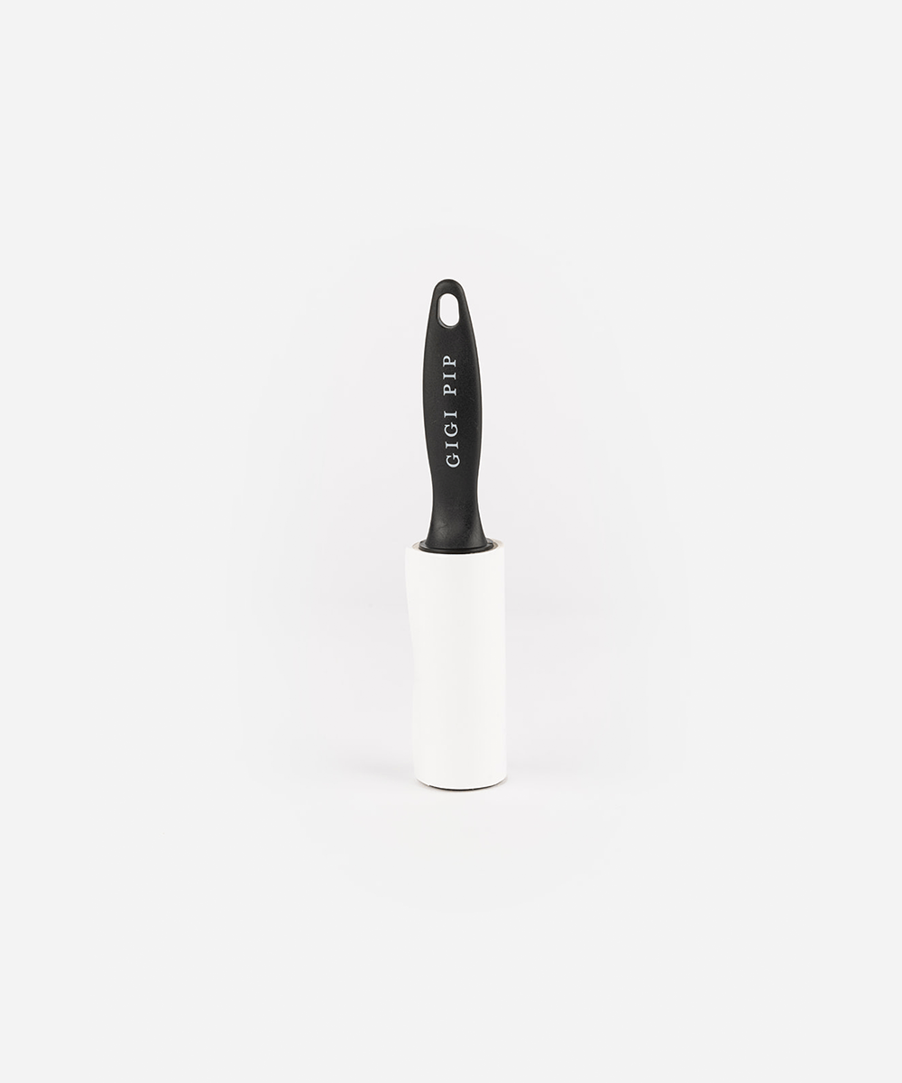 Black lint roller on a white background #color_black