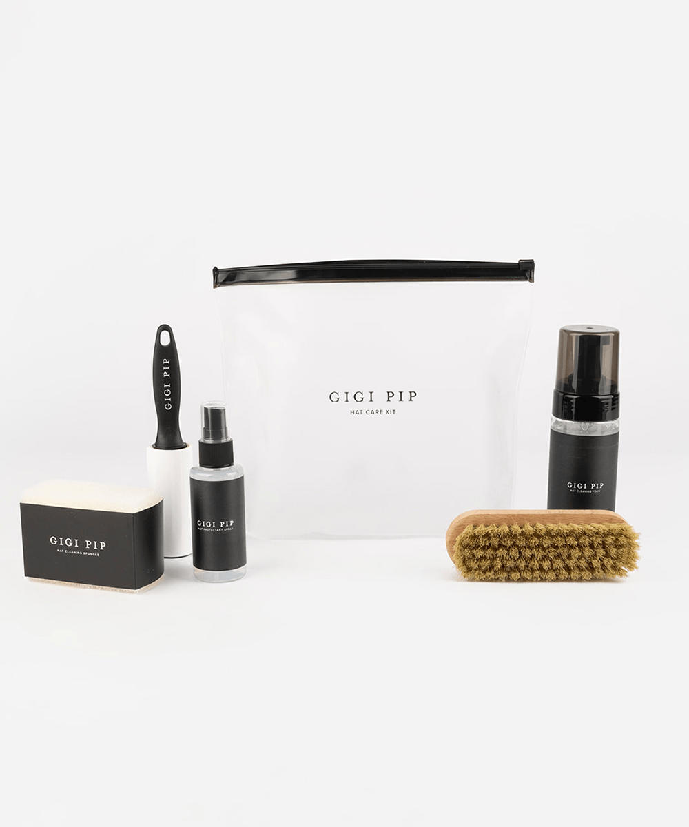 Gigi Pip hat care kit with various products on a white background #color_black