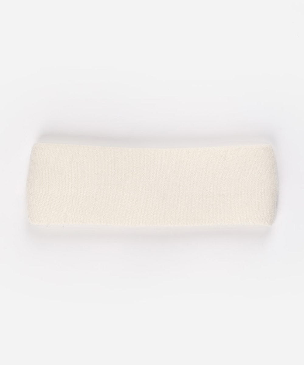 An ivory colored headband on a plain background #color_ivory