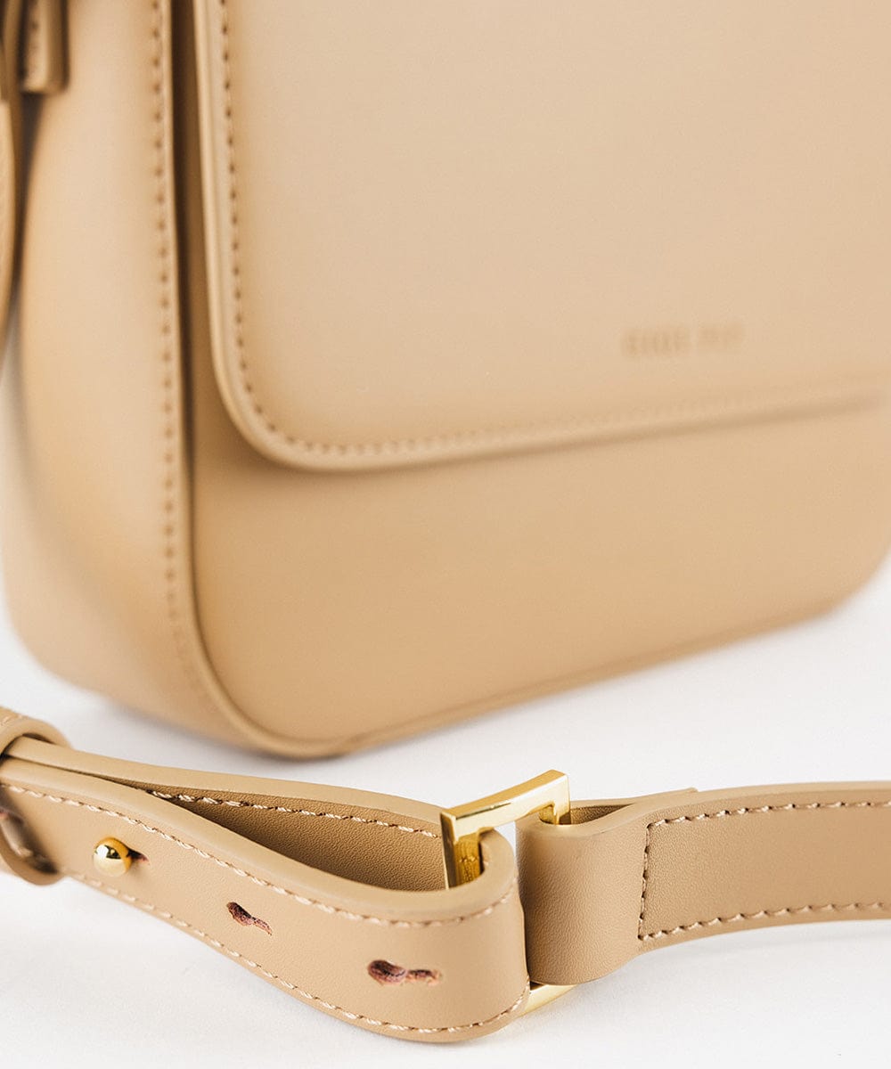 A tan Rhys Crossbody Genuine Leather Bag on a plain background #color_tan