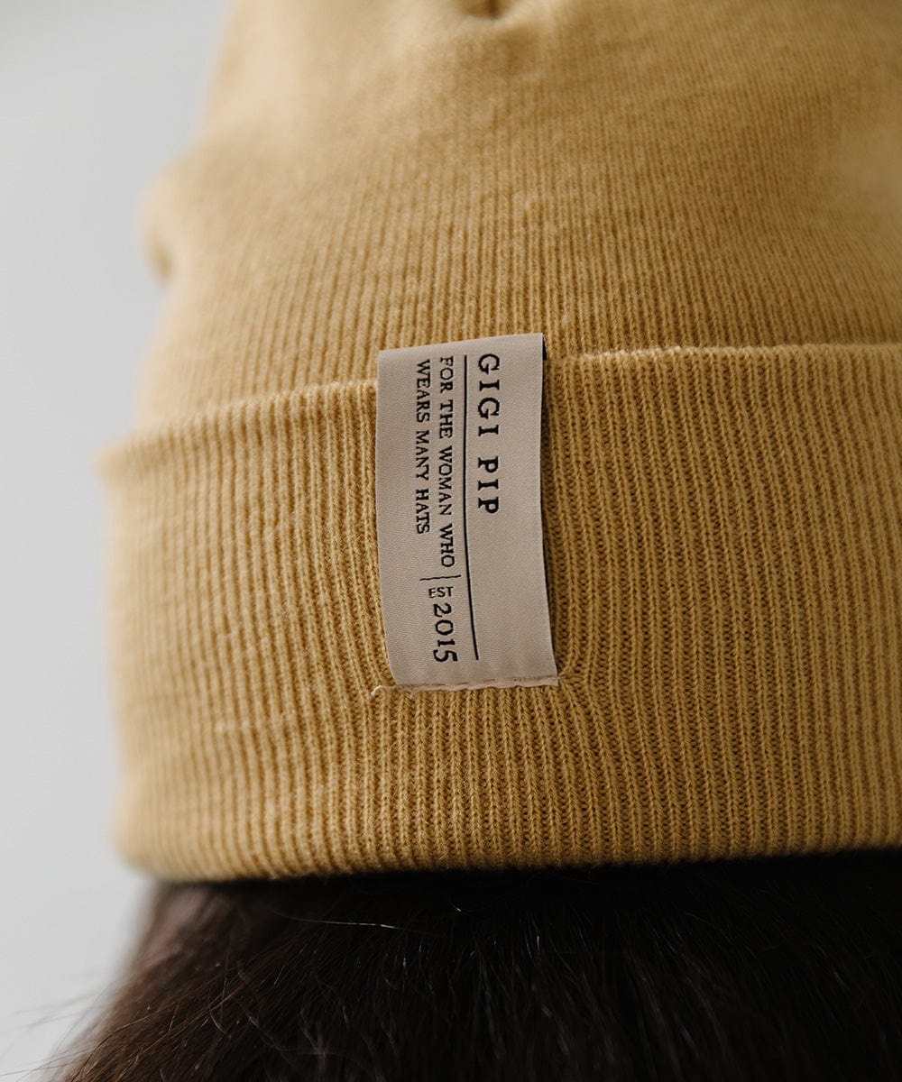 Close up image of a honeycomb colored beanie with the brand label #color_honeycomb