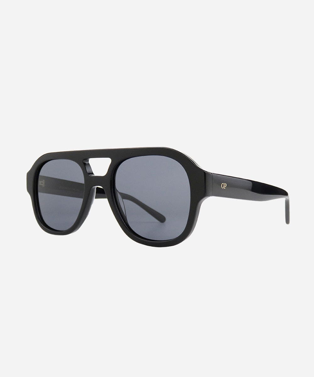 A pair of black retro aviator sunglasses with an oversized frame and gradient tinted lenses, from tip to tip #color_black