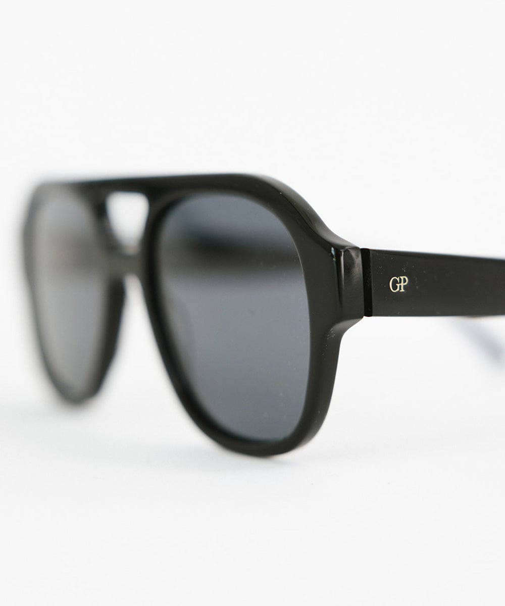 Black aviator sunglasses on a plain background #color_black