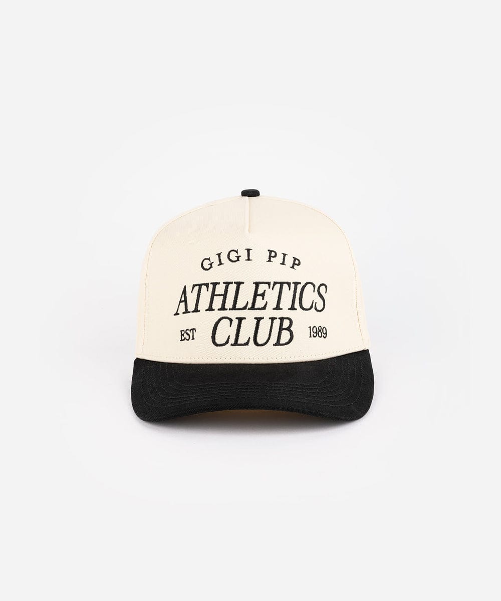 Cream and black Trucker hat with 'Gigi Pip Athletics Club' text on a white background #color_cream - black