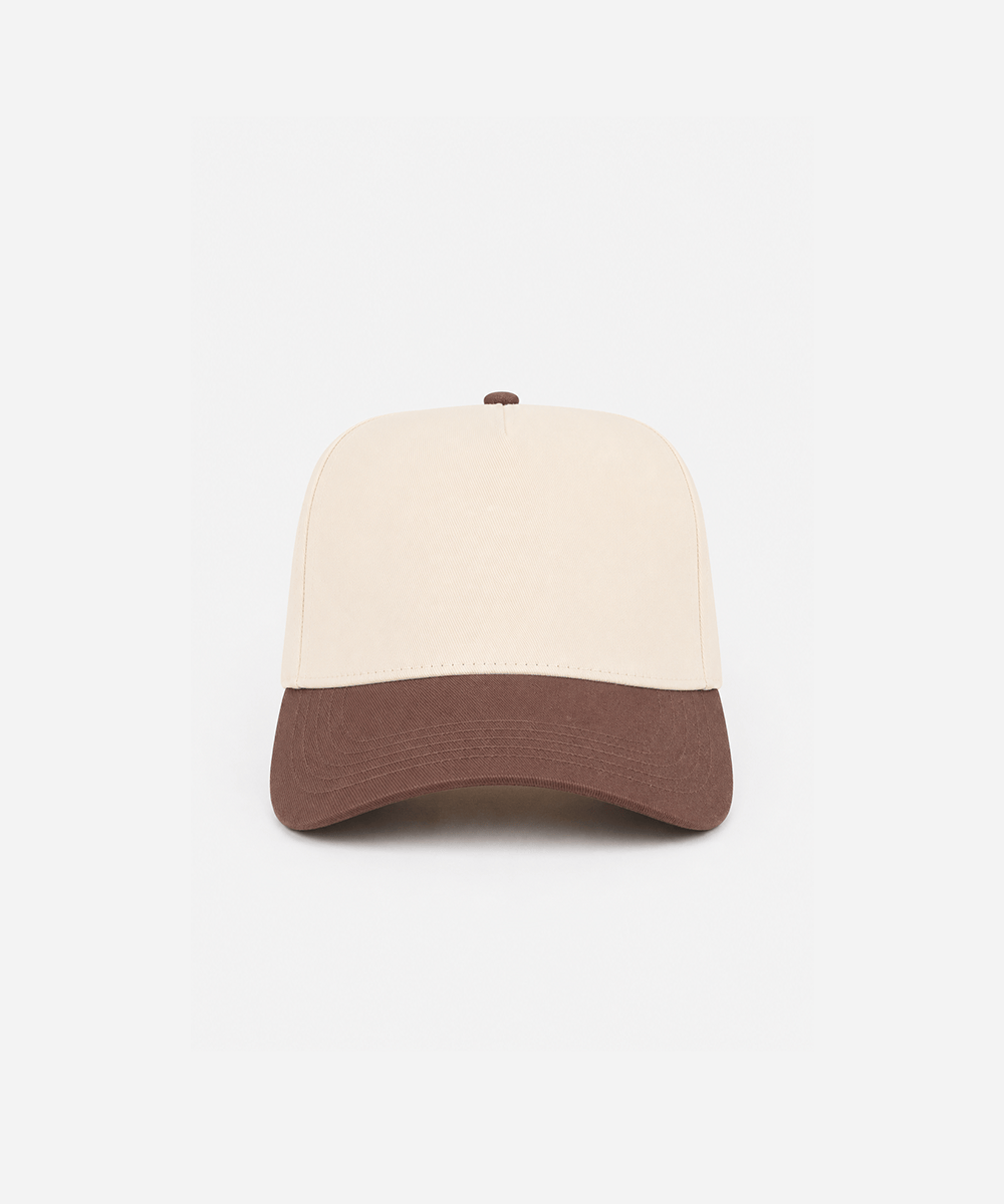 A structured baseball cap with a cream-colored crown and a contrasting brown visor, photographed against a solid light gray background #color_cream - brown