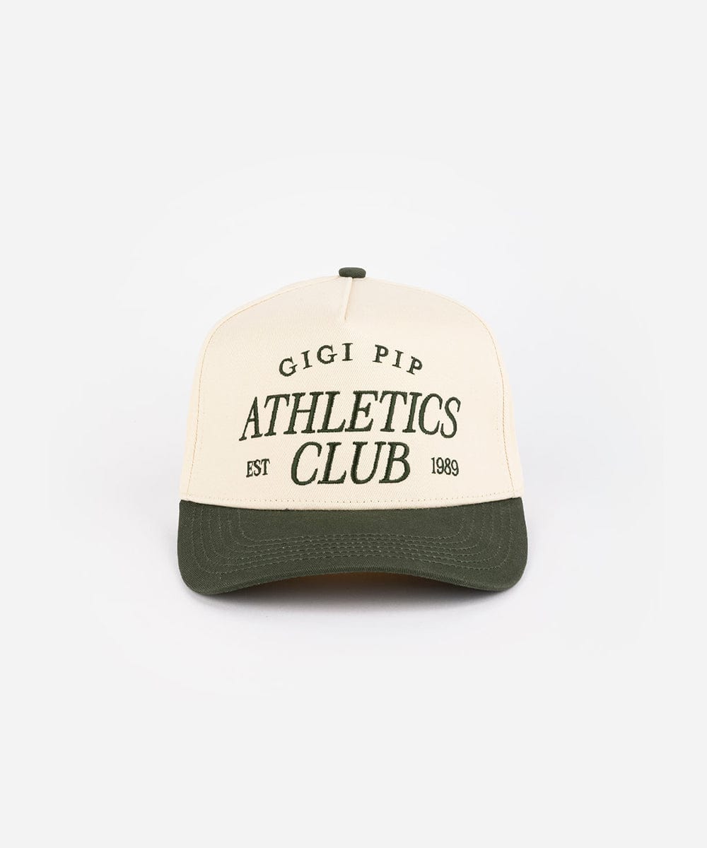 Cream and dark green Trucker hat with 'Gigi Pip Athletics Club' text on a white background #color_cream - dark green