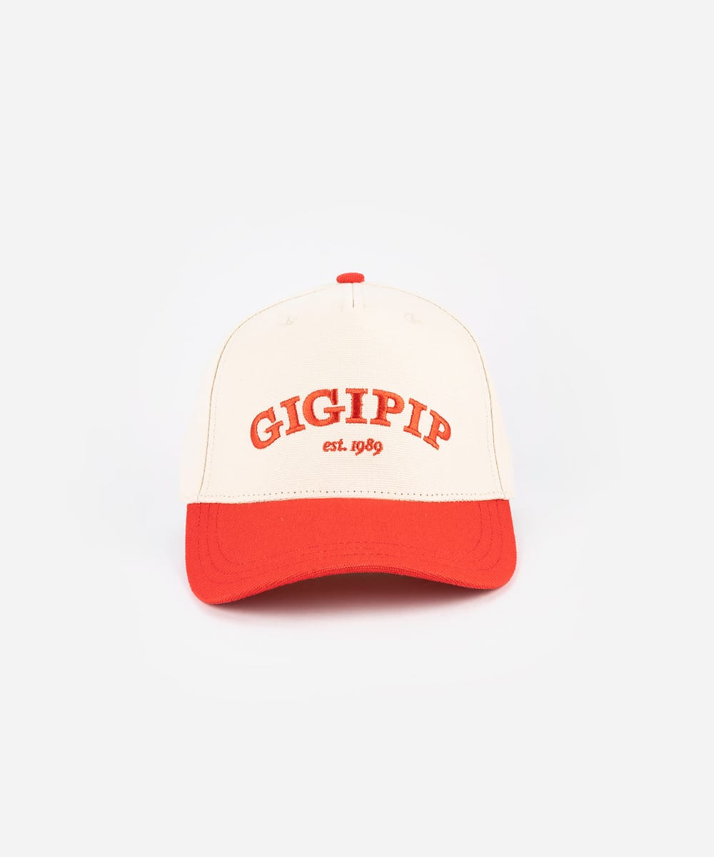 White and red cap with 'GIGIPIP' branding on a white background #color_cream-red