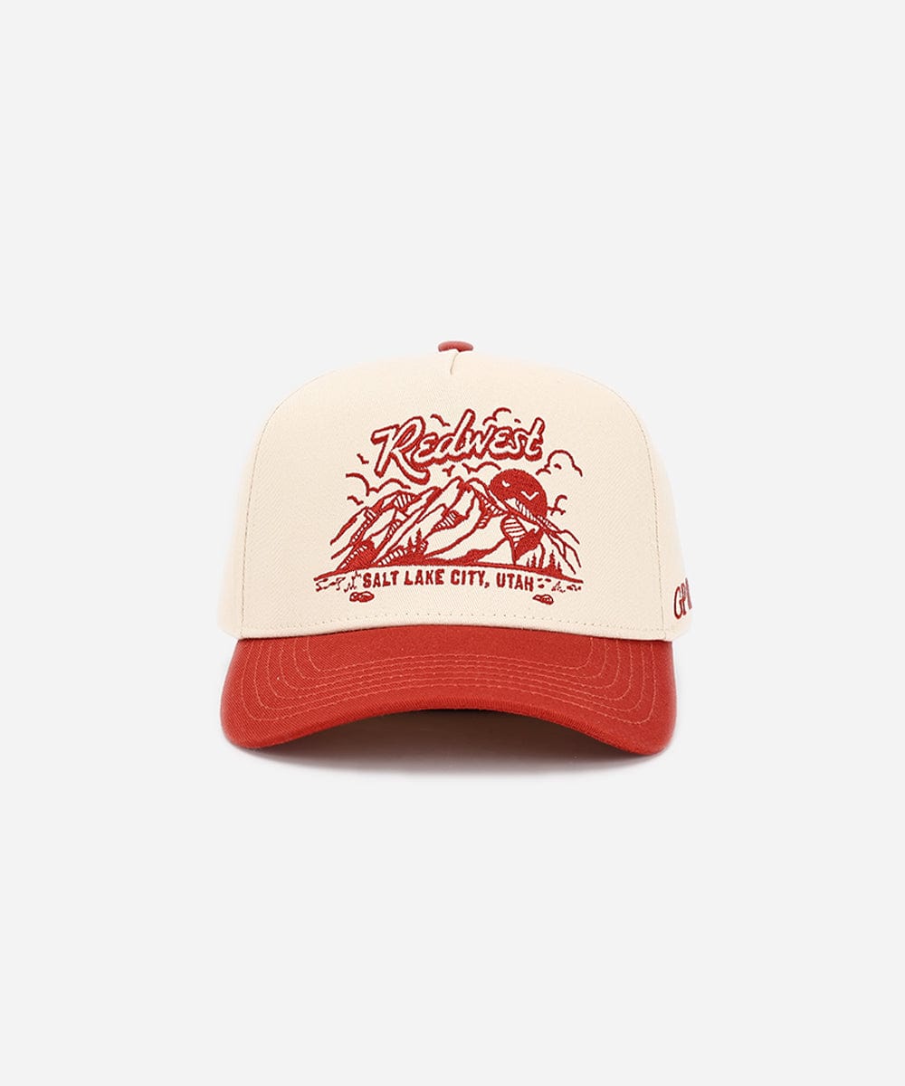 Red and white cap with graphic design on a white background #color_cream - rust red
