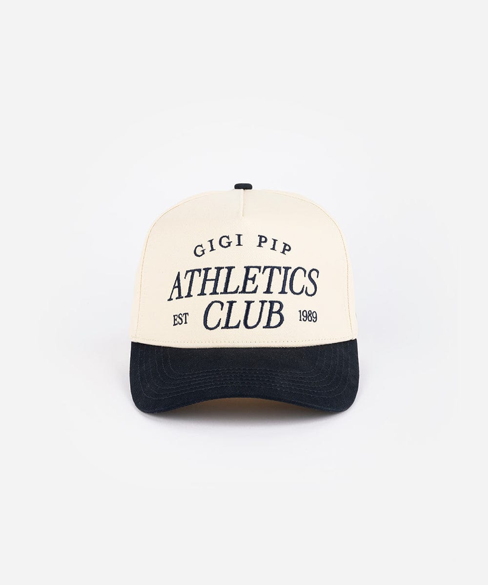 Navy Trucker hat with 'Gigi Pip Athletics Club' text on a white background #color_navy