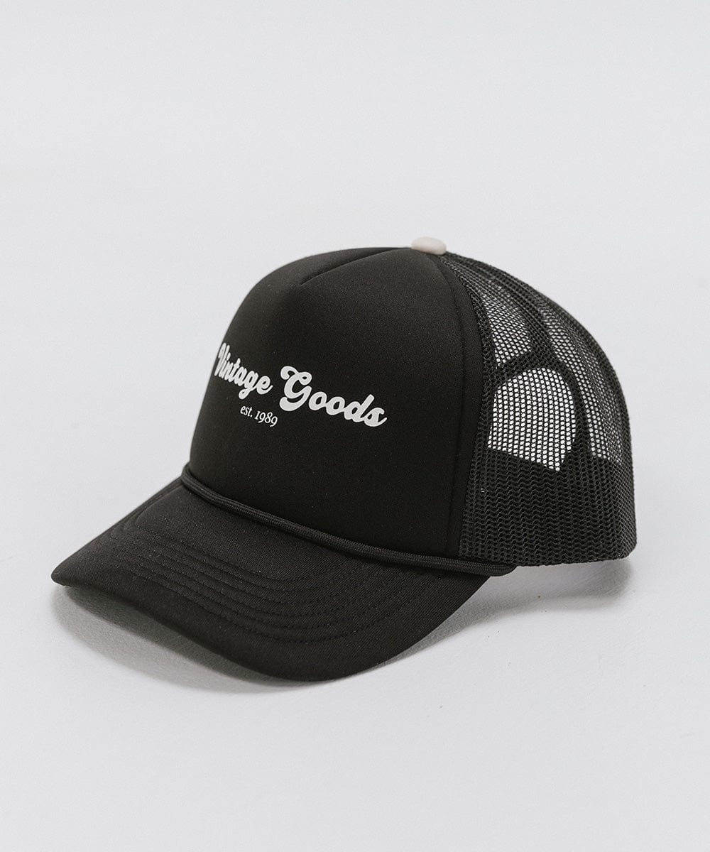 A black trucker hat with 'Vintage Goods' text on a white background #color_black