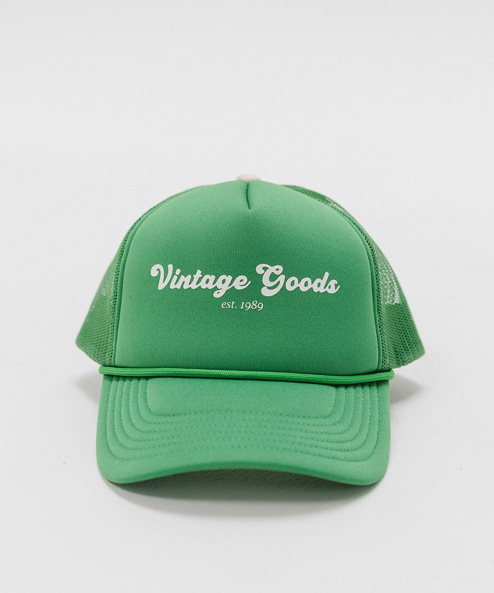 A vintage green colored trucker hat with 'Vintage Goods' text on a white background #color_vintage green