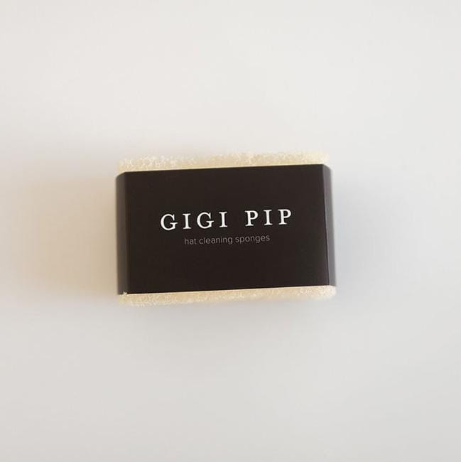 A hat cleaning sponge with the brand label 'GIGI PIP' on a plain background #color_black