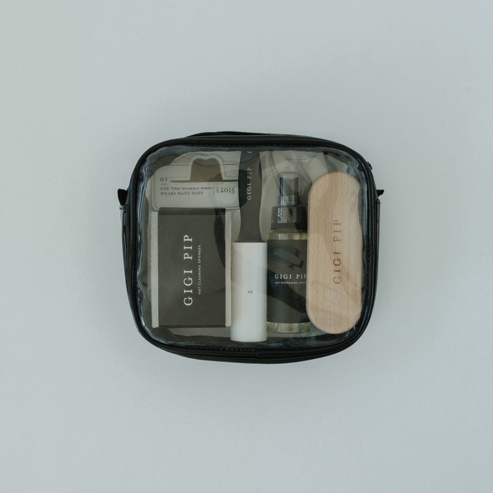 A black hat care it with all the required hat care products on a plain background #color_black