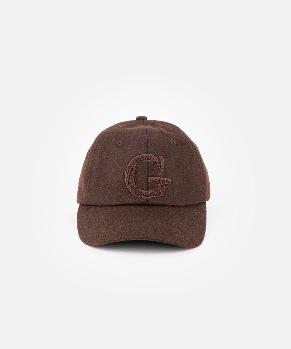 A chocolate brown baseball cap with the letter 'G' on a white background  #color_chocolate brown