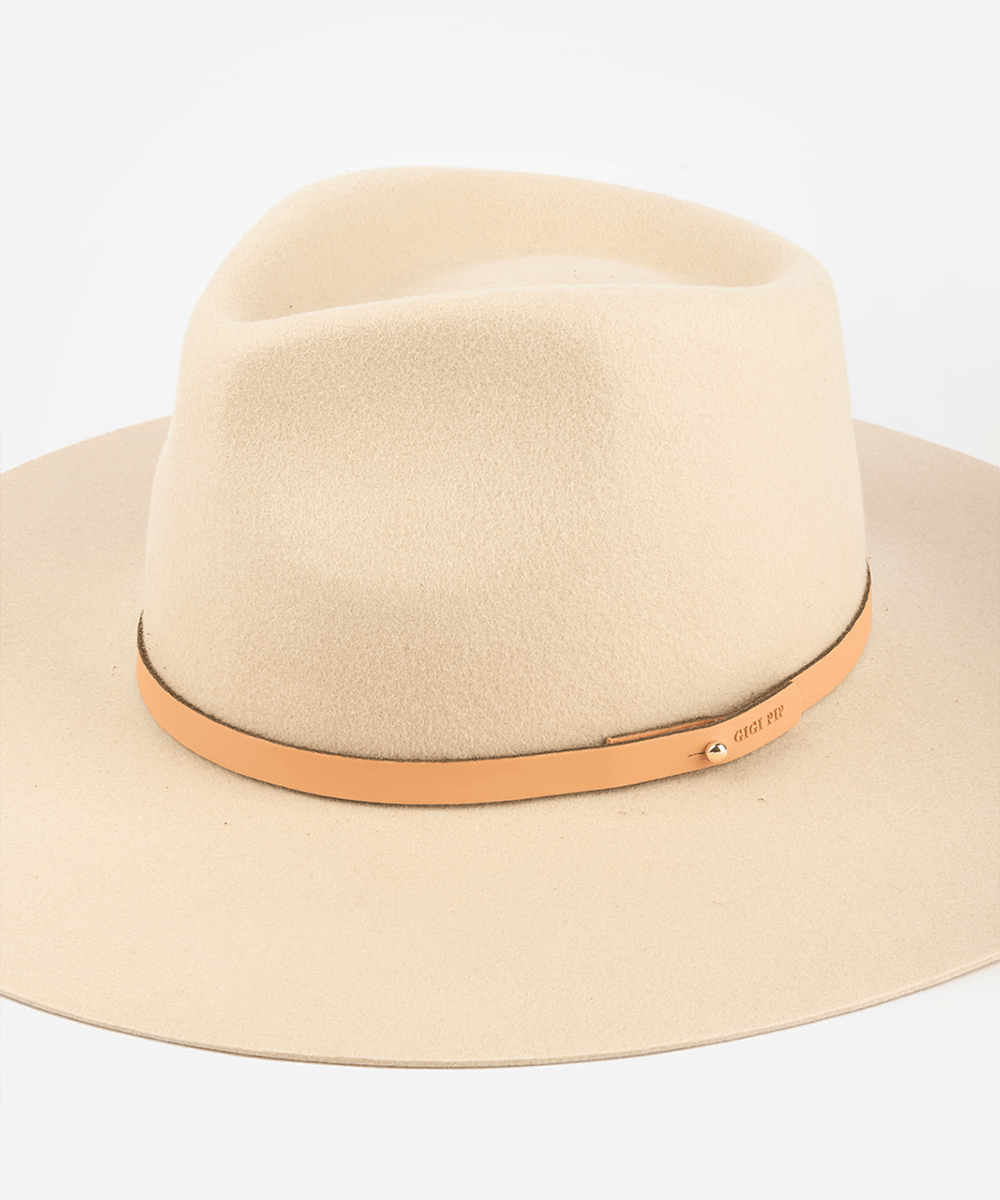 A pink cowboy hat with a sunset colored genuine leather thin hat band on a white background #color_sunset