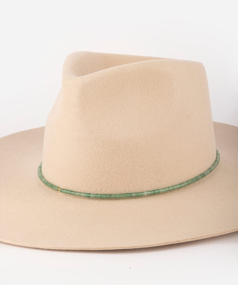 Beige cowboy hat with a green band on a white background #color_green jade